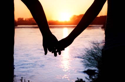 couple-holding-hands-in-sunset.jpg